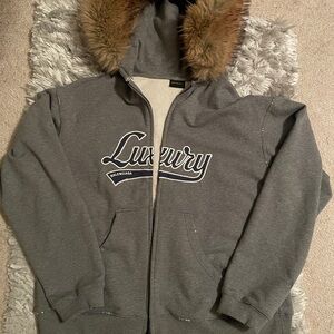 Dark grey Fur lined hoodie . Balenciaga Luxury blue Logo. Double zipper.
